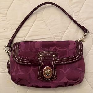 Purple Coach wristlet with 2 pockets